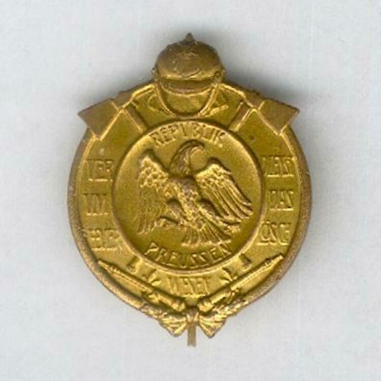 Gilded bronze badge obv